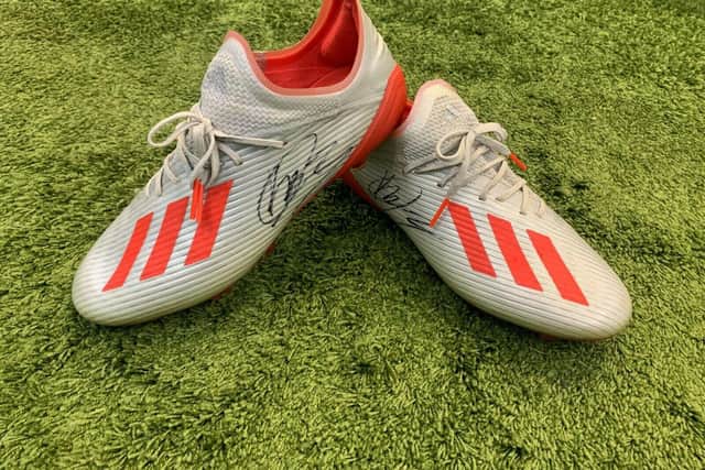 Football boots belonging to Kalvin Phillips, which have been signed and are being auctioned on eBay for the Children's Heart Surgery Fund