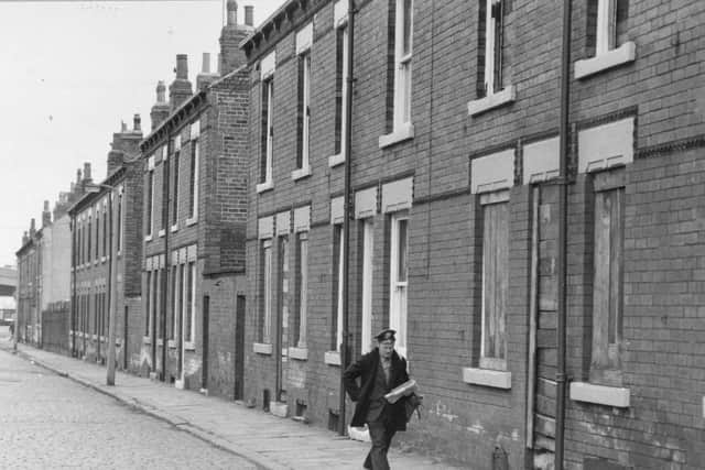 A postman makes his deliveries in Holbeck in 1979.