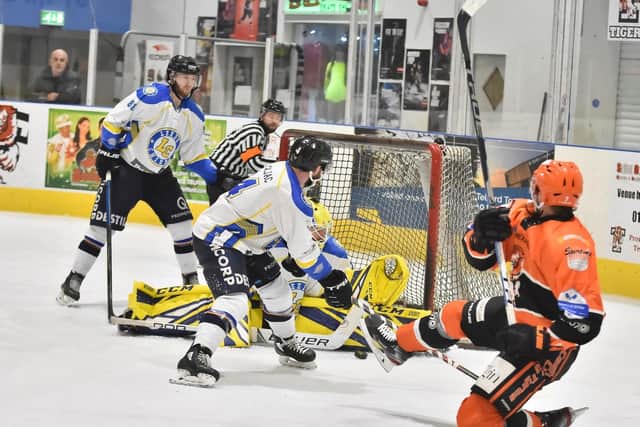 Sam Gospel (partly hidden) gets down low to deny Telford's Domink Florian in the third period on Sunday night. Picture courtesy of Steve Brodie.