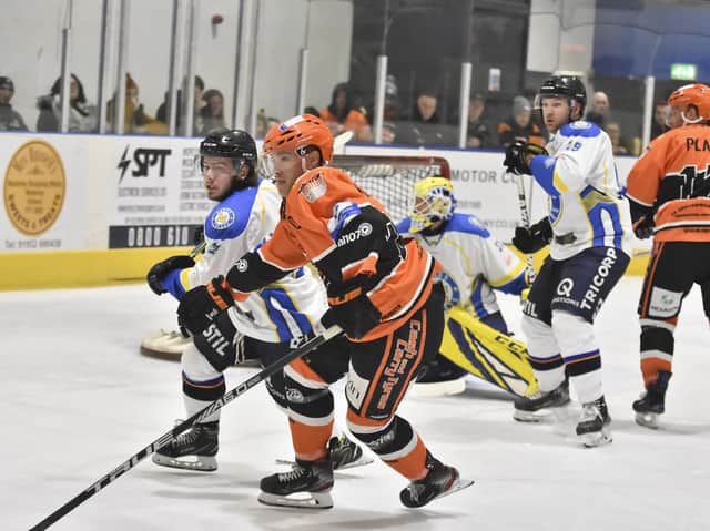 Lewis Houston, far left, battles for possession during Sunday night's clash at league leaders Telford Tigers. Picture courtesy of Steve Brodie.