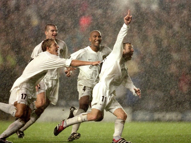 A catastrophic error from AC Milan's goalie Dida handed Leeds a priceless victory at waterlogged Elland Road. He fumbled a hopeful 30-yard drive from Lee Bowyer with just two minutes remaining to give Whites the win.