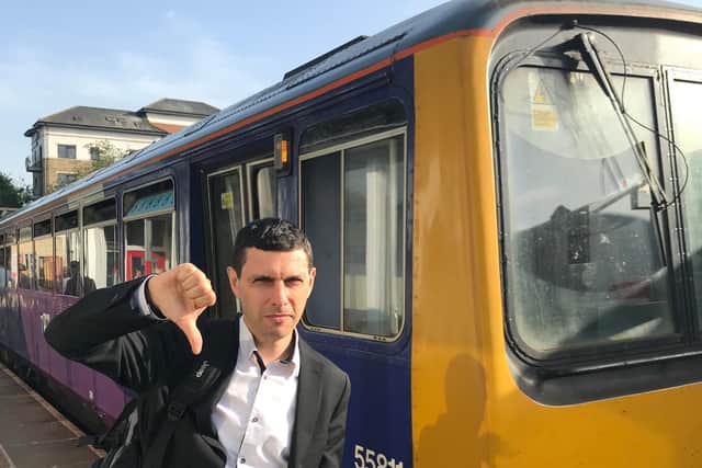 MP Alex Sobel gives the thumbs down to a Northern Pacer train.