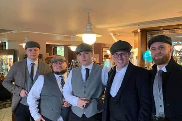 Joe, centre, pictured with family and friends at his Peaky Blinders themed 18th birthday party