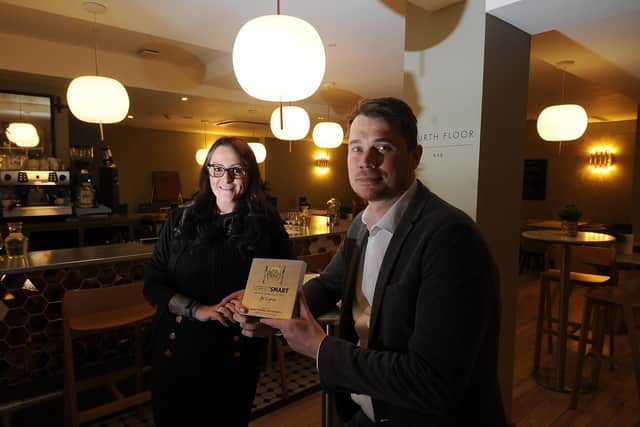 Hospitality Manager Phil Lockwood and Restaurant manager Vikki Humble pictured with the Street Smart award at the 4th floor Restaurant, Harvey Nichols.