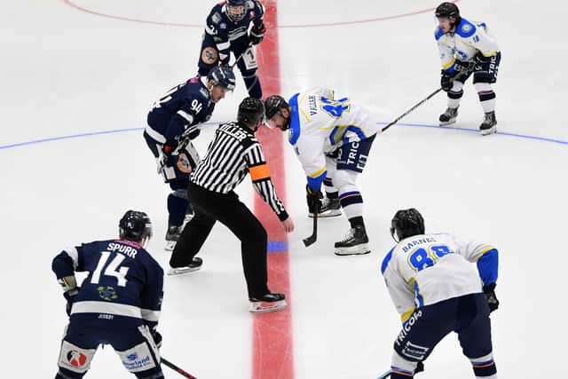 MAKING HISTORY: Leeds Chiefs' Patrik Valcak, right, faces off against Sheffield Steeldogs' Vladimir Luka for the first ever puck drop at Elland Road. Picture: Jonathan Gawthorpe.