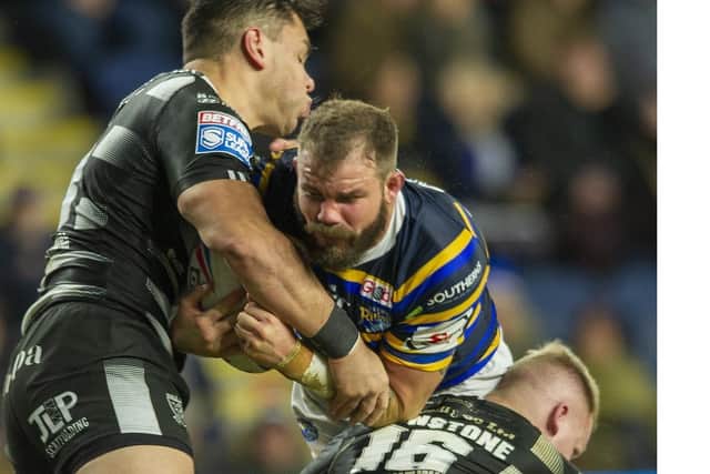 Adam Cuthbertson is wrapped up by Hull's  Andre Savelio and Jordan Johnstone. Picture by Tony Johnson.