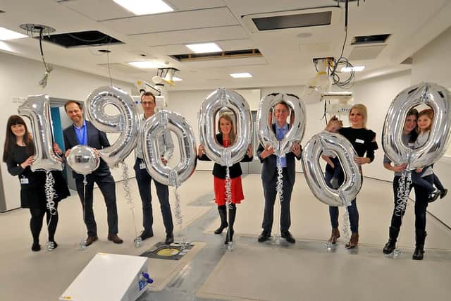 2018: Sharon Milner, CEO of CHSF and Julian Hartley, chief executive for the Leeds Teaching Hospital NHS Trust, centre with staff and CHSF families celebrating the 1.9m raised towards the cost of a new hybrid theatre. Picture Tony Johnson.