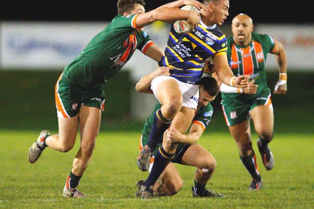Leeds Tyler Dupree takes on the Hunslet defence.Picture by Craig Hawkhead.