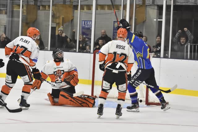 Leeds Chiefs' Andres Kopstals, far right, celebrates Lewis Houston's (hidden) winning strike in overtime to beat leaders Telford Tigers. Picture courtesy of Steve Brodie.