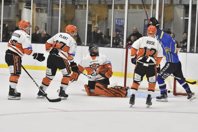 Lewis Houston (off-camera) hits the game-winner as Andres Kopstals (part-hidden) celebrates the 3-2 overtime victory for Leeds Chiefs over Telford Tigers. Picture courtesy of Steve Brodie.