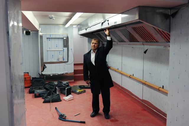 Azram Chaudhry pictured in December 2015 in the basement kitchens that were flooded to the top of the ceiling.