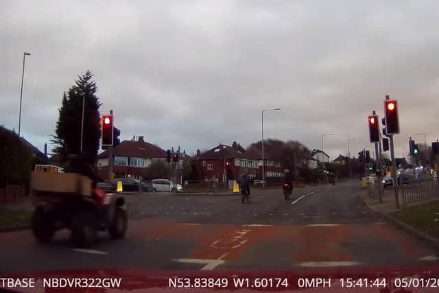 The dash cam footage, provided by Nextbase, shows the gang of bikers run a red light