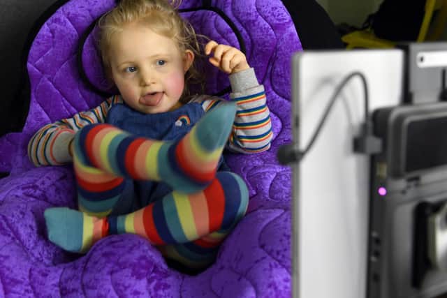 Tilly West using the eye gaze technology which allows her to communicate