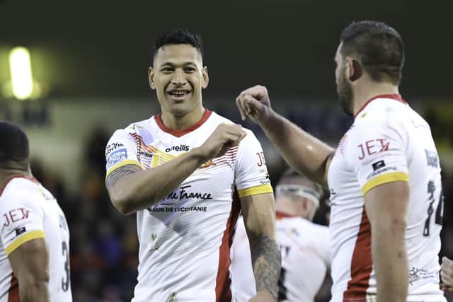 Israel Folau celebrates his try for Dragons
