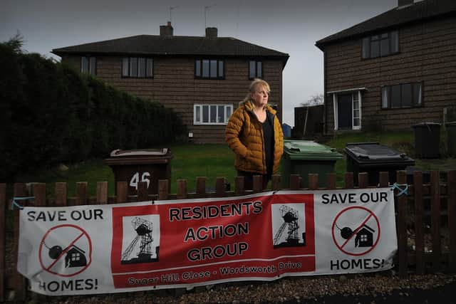 Cindy Readman outside her home on Wordsworth Drive where they have a Save Our Homes campaign.