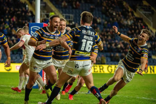 Richie Myler celebrates with Luke Gale after scoring against Hull KR.