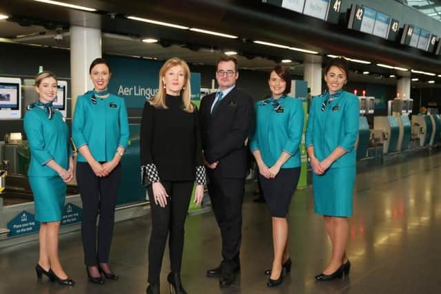 Aer Lingus cabin crew this month sported for first time new uniform, designed by "queen of irish fashion" Louise Kennedy, now worn by over 4,000 airline staff.