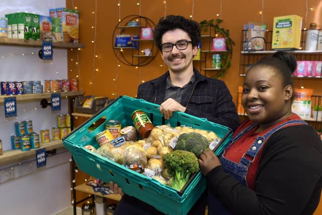 Lyndon Wallace, student group-cordinator and Eleanor Claxton, a student volunteer with food in the student foodbank near to The Hive at Leeds Beckett University.
