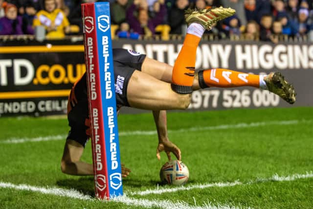 James Clare scores a spectacular try against Wakefield. Picture by Bruce Rollinson.
