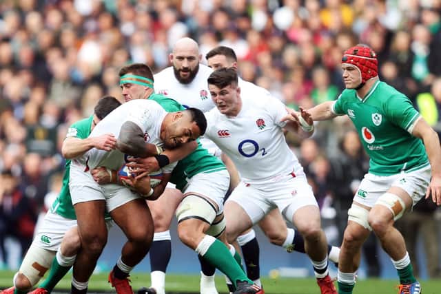 England's Manu Tuilagi is tackled during the Guinness Six Nations match (David Davies/PA Wire)