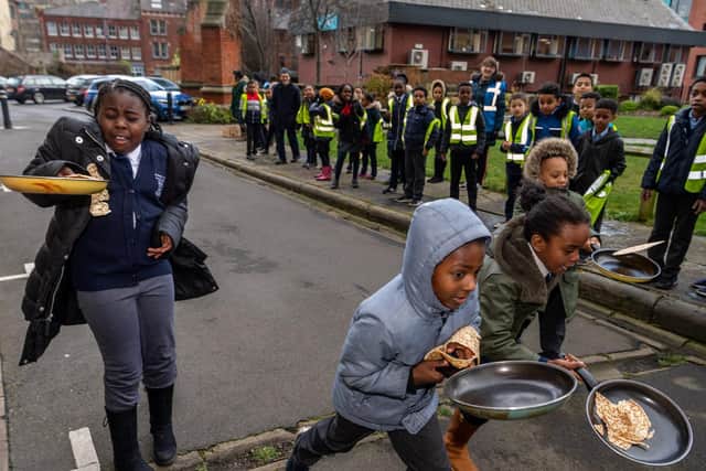 Pupils from St Peter's Primary school, taking part in pancake races at Leeds Minster.
