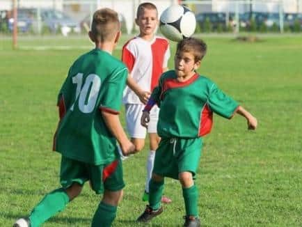 Primary school children have been banned from heading footballs in training. Picture: Shutterstock.