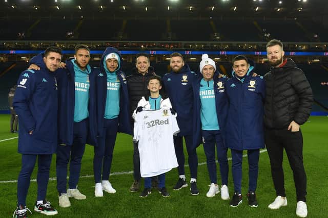 Oliver and his uncles Adam and Nick posed for pictures with the Leeds United squad (Pic: Leeds United)