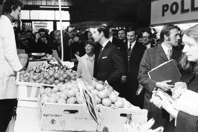 Prince Charles chats to a greengrocer in Kirkgate Market during his visit in 1975.