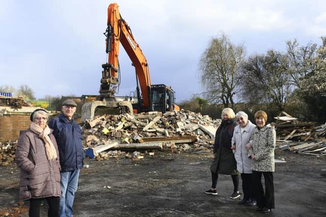 Local residents, l to r.. Penny and Terry Took, Cathy Bell, Virginia Aicken and Vincentsia Ford watching The Gate pub on Kentmere Avenue in Seacroft , Leeds  finally being demolished.