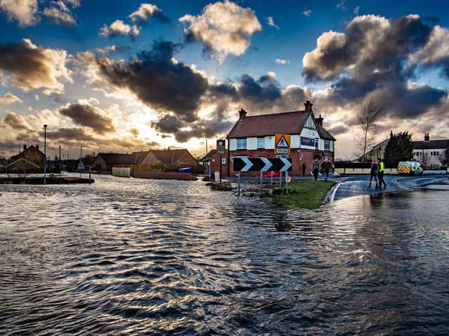 Dark skies over East Cowick, East Yorkshire, as floodwater continues to affect many properties in the village. Picture: James Hardisty