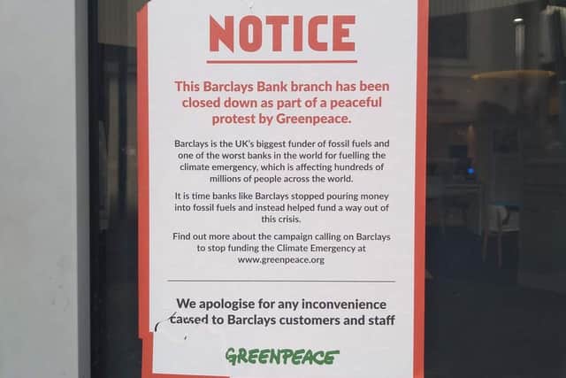 A notice posted on the Barclays door by Greenpeace activists (Photo: Kit Taylor)