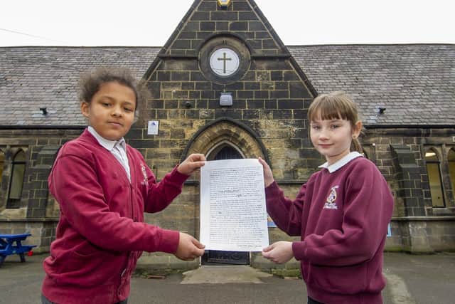 Year 6 pupils Anaiyah McIntosh and Klaudia Szep and the letter from playwright Alan Bennett