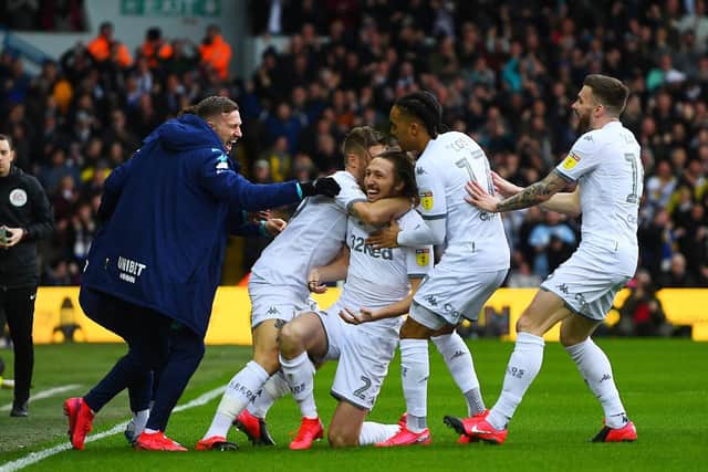 IN THE THICK OF IT: Gaetano Berardi, left, grabs goalscorer Luke Ayling to celebrate Leeds United's opening goal in Saturday's 2-0 win at home to Huddersfield Town.