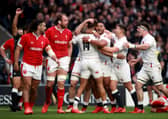 England's Anthony Watson (No.14) celebrates with his team-mates after scoring a try against Wales.
