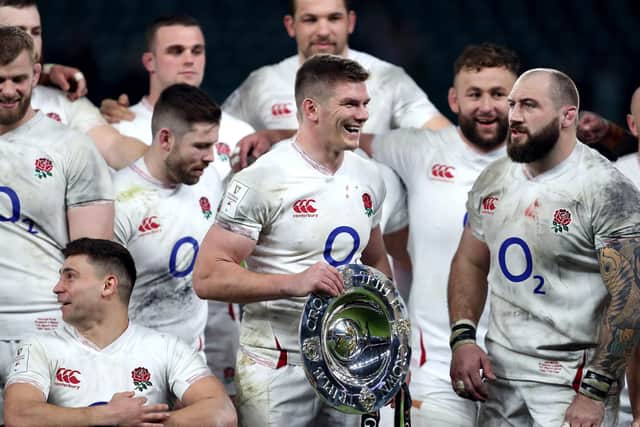 England's captain Owen Farrell holds the Triple Crown at Twickenham. Picture: David Davies/PA