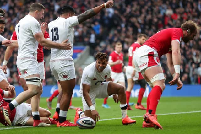 England's Anthony Watson (centre) celebrates his sides first try of the game at Twickenham. Picture: David Davies/PA