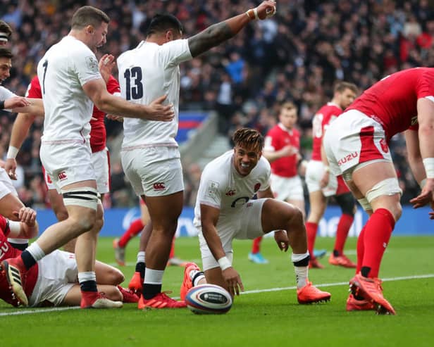 England's Anthony Watson (centre) celebrates his sides first try of the game at Twickenham. Picture: David Davies/PA