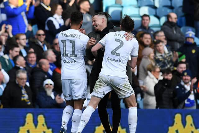 Kalvin Phillips congratulates Tyler Roberts and Luke Ayling at full time.