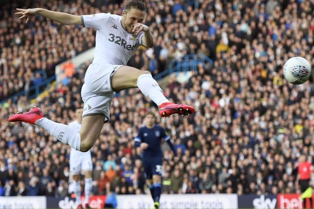 Luke Ayling fires home Leeds United's opening goal against Huddersfield Town.