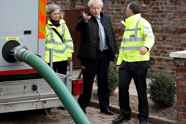 Prime Minister Boris Johnson meets with local residents in Bewdley in Worcestershire to see recovery efforts following recent flooding in the Severn valley and across the UK. Photo: Getty