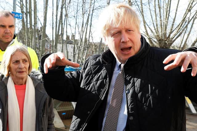 Prime Minister Boris Johnson meets with local residents in Bewdley in Worcestershire to see recovery efforts following recent flooding in the Severn valley and across the UK. Photo: PETER NICHOLLS/PA Wire
