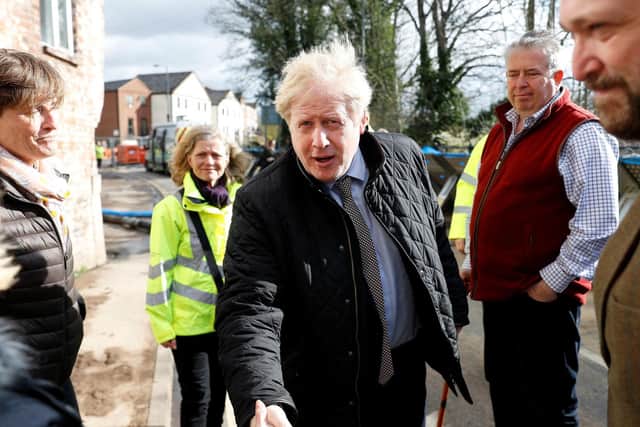 Prime Minister Boris Johnson meets with local residents in Bewdley in Worcestershire to see recovery efforts following recent flooding in the Severn valley and across the UK. Photo: PETER NICHOLLS/PA Wire