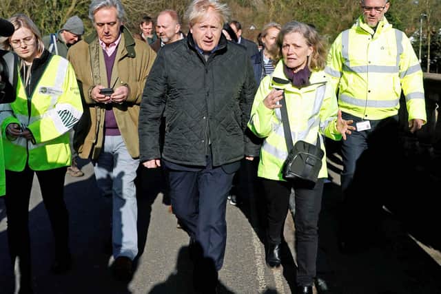 Prime Minister Boris Johnson meets with local residents in Bewdley in Worcestershire to see recovery efforts following recent flooding in the Severn valley and across the UK. Photo: PETER NICHOLLS/PA Wire
