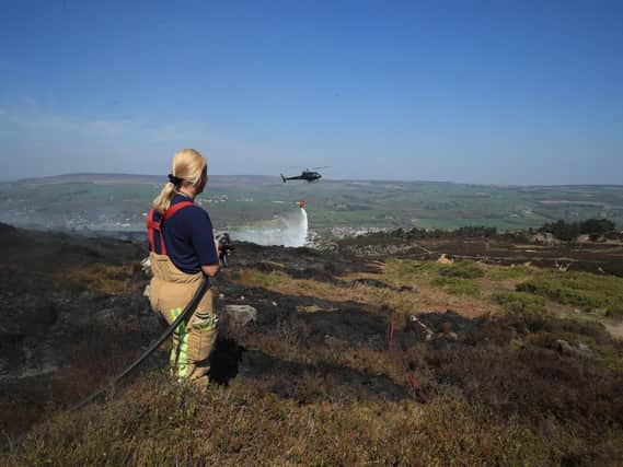 Firefighters tackle the blaze on Ilkley Moor last year.