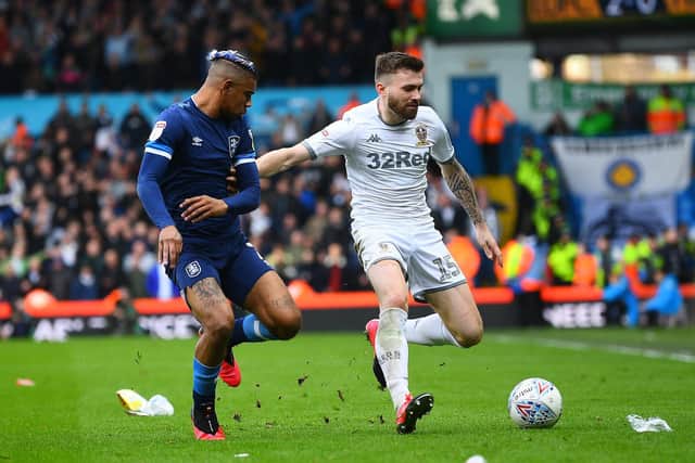 GRINDING IT OUT: Leeds United left back Stuart Dallas, right, during Saturday's 2-0 win at home to Huddersfield Town. Picture by Jonathan Gawthorpe.