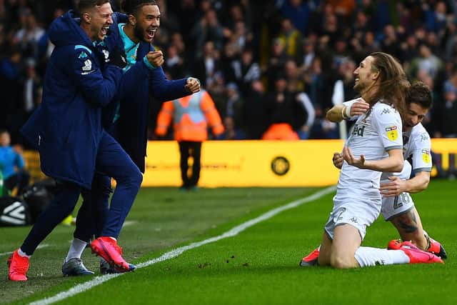HAILING AYLING: Substitutes Barry Douglas and Tyler Roberts greet Luke Ayling who is hugged by Gaetano Berardi after the Leeds United defender's stunning strike in Saturday's 2-0 win against Huddersfield Town. Picture by Jonathan Gawthorpe.
