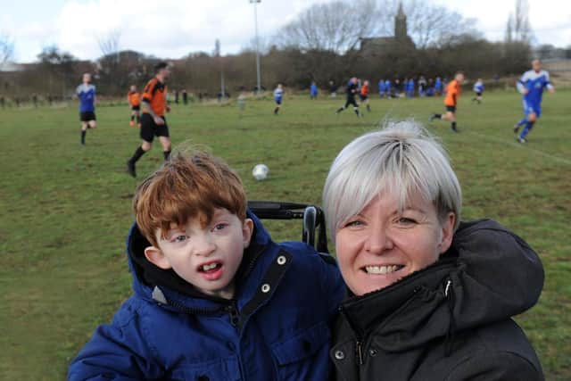 Eizabeth McOmish-Rooney at the match wit her with her son Oliver Rooney.
Photo: Steve Riding