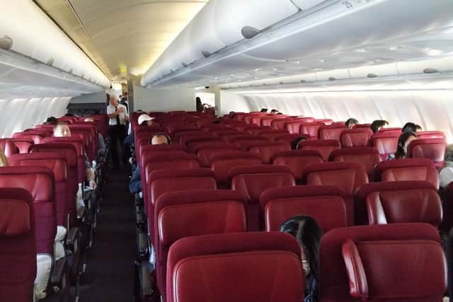 Handout photo dated 06/03/20 issued by the twitter feed of Nick Radge/@thechartist, showing empty seats on a Qantas flight from Brisbane to Narita Tokyo, due to coronavirus fears.