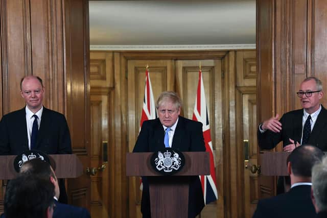 Prime Minister Boris Johnson, alongside Chief Medical Officer for England Chris Whitty (left) and Chief Scientific Adviser Sir Patrick Vallance (right), during a press conference, at 10 Downing Street (Photo: Alberto Pezzali/PA Wire)