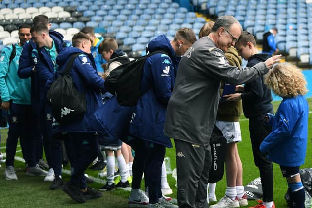 Leeds United altered their entry to Elland Road due to Coronavirus concerns but were still met by a small welcome committee on Saturday (Pic: Jonathan Gawthorpe)